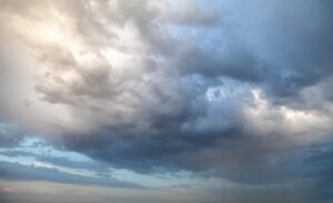 Puffy dark clouds in the sky, concept of worry and fear